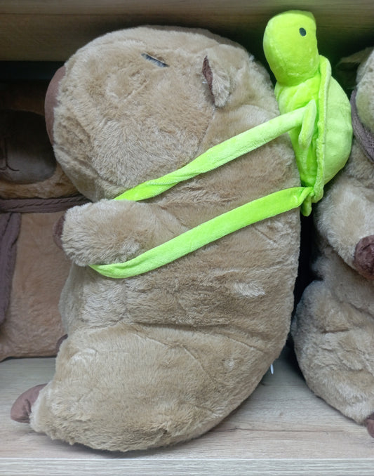 Peluche capibara con cobija